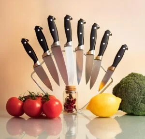 multiple paring knives arranged on kitchen countertop after they are Cleaned and Sanitized - bladesjournal