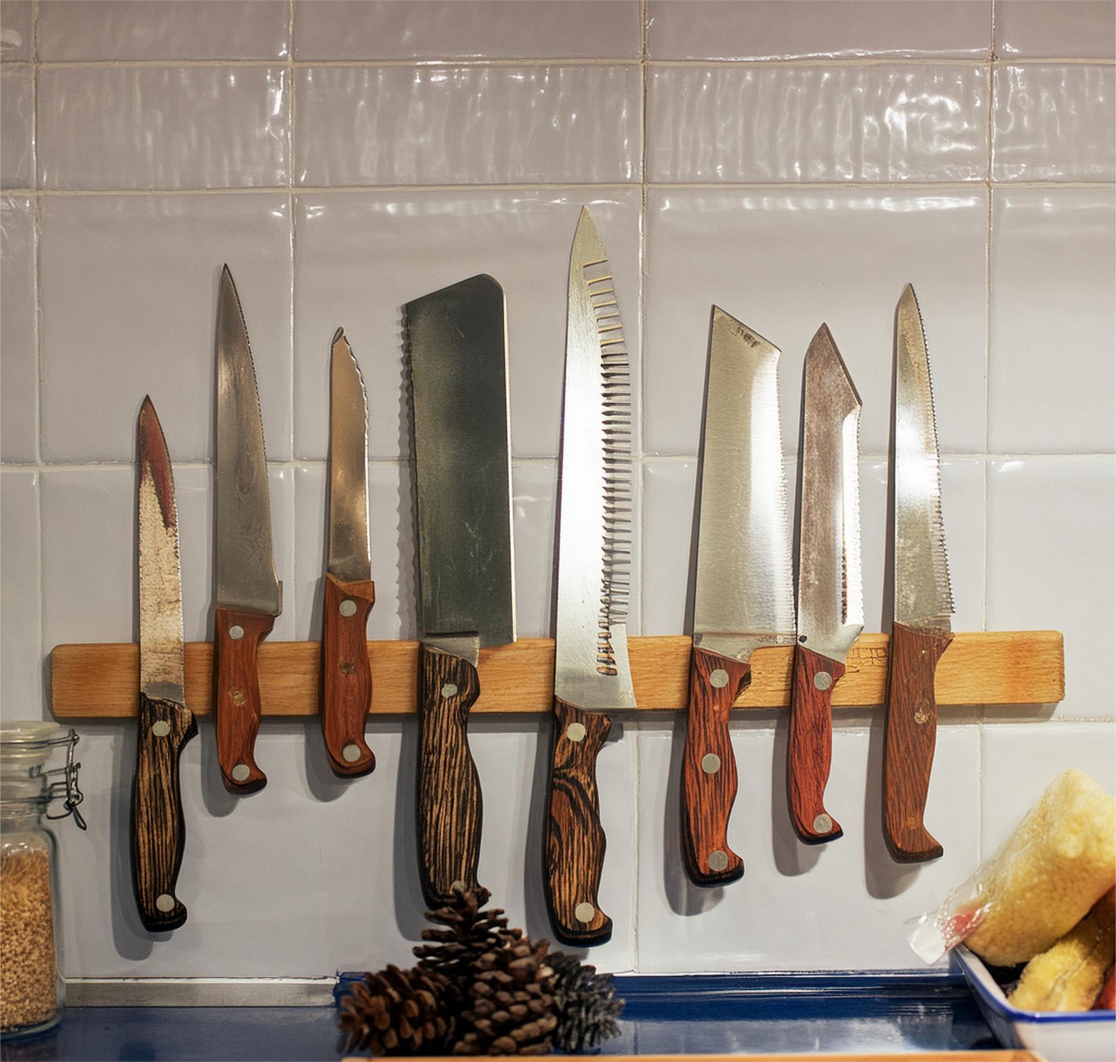 magnetic knife strip mounted horizontally on the wall - bladesjournal